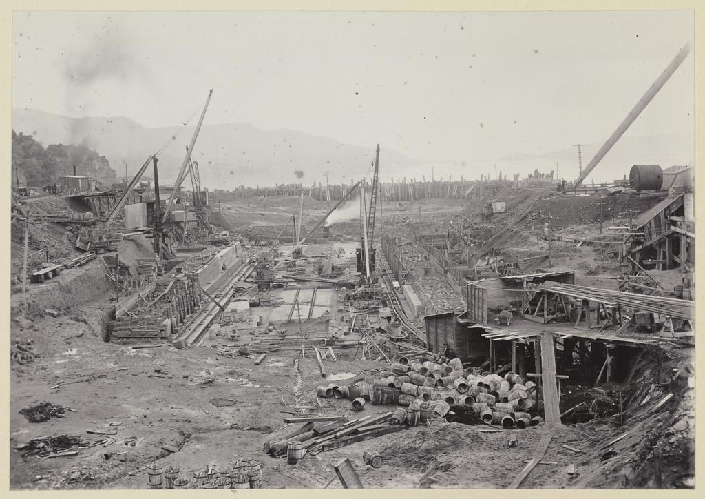 Construction site showing barrels and platforms