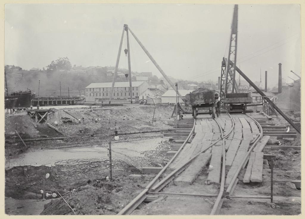 View of cranes, trucks and pulleys