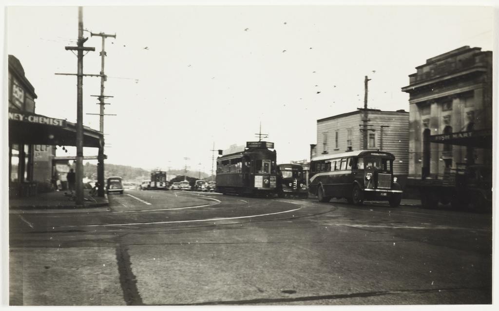 Two buses and a tram at Hall Corner, Auckland