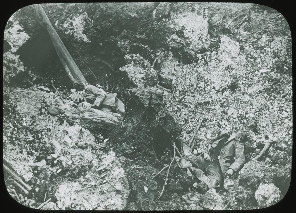 Two mortally wounded German soldiers in the ruins of their trench