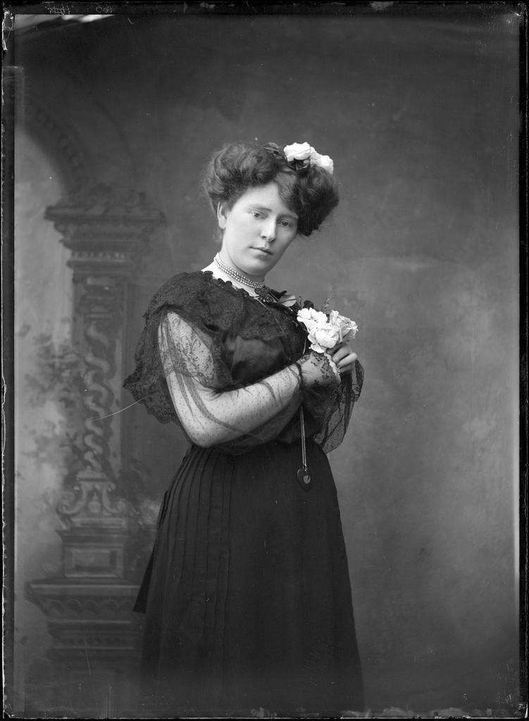 Young woman holding three roses