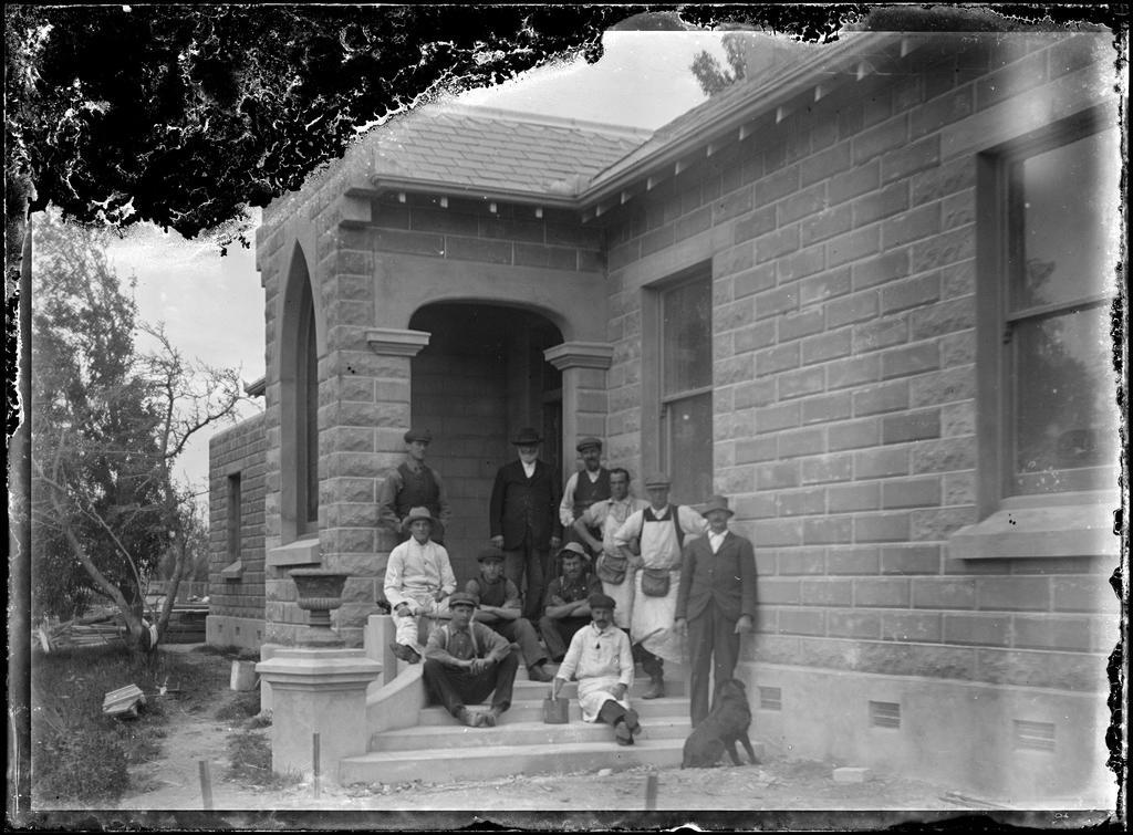 Men outside Oamaru stone building