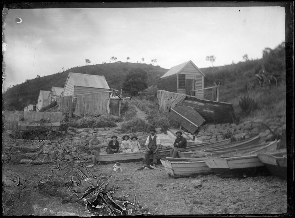 Fishermen with nets out to dry