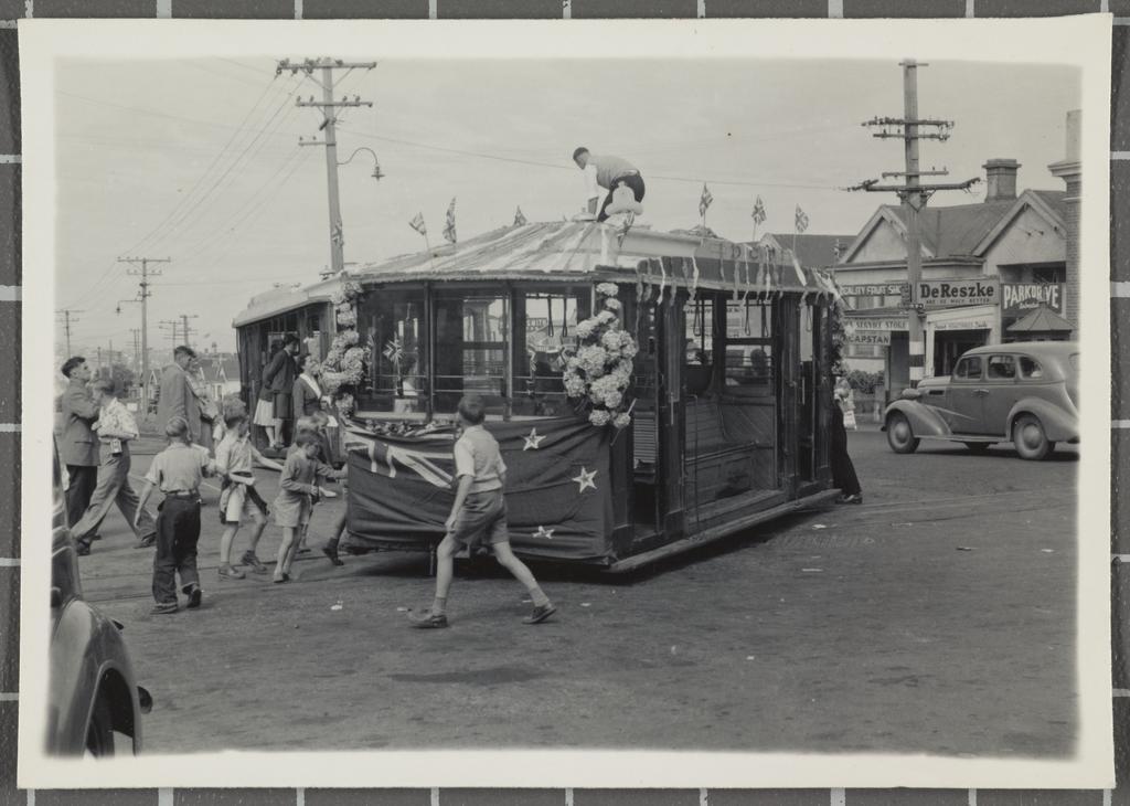 Combination Dummy no.101: Swinging car round on turntable while crew member puts finishing touches to decorations