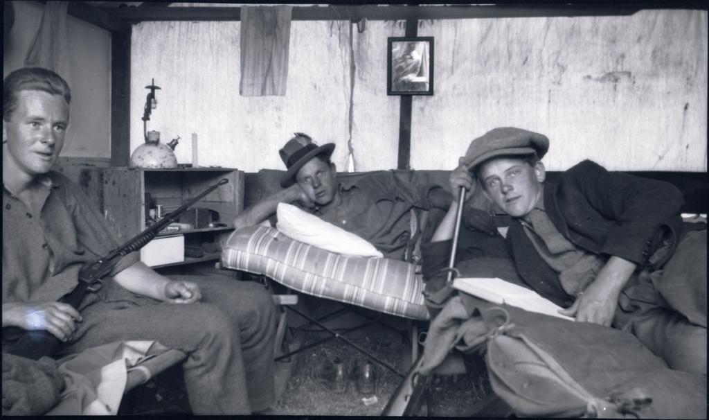 Three men inside a cabin, Beaumont