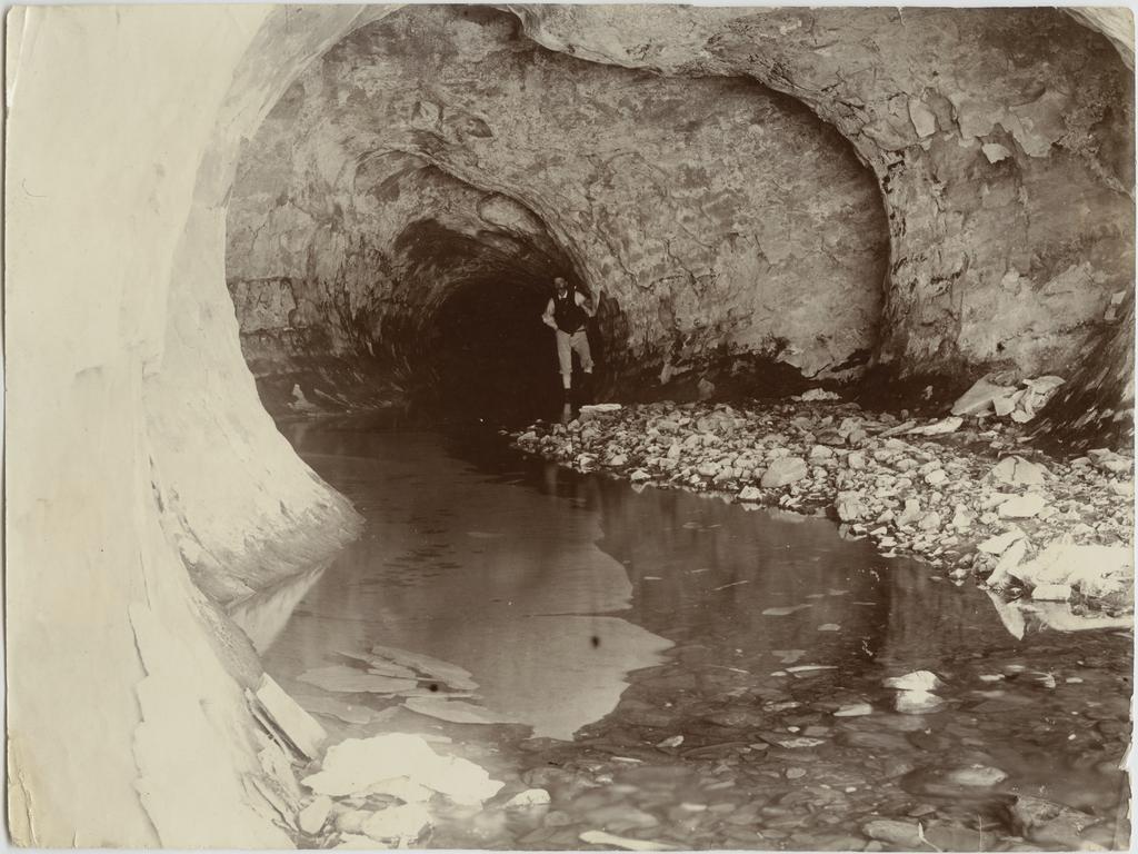 Man inside cave, Cave Stream
