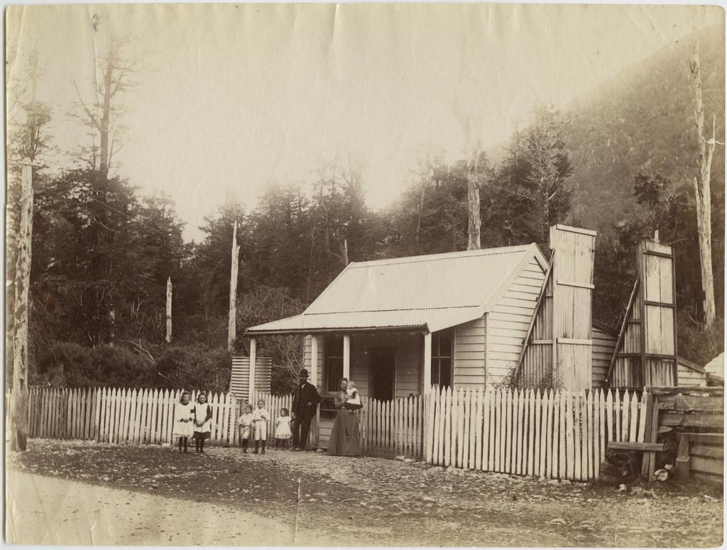 Family outside their home on the West Coast