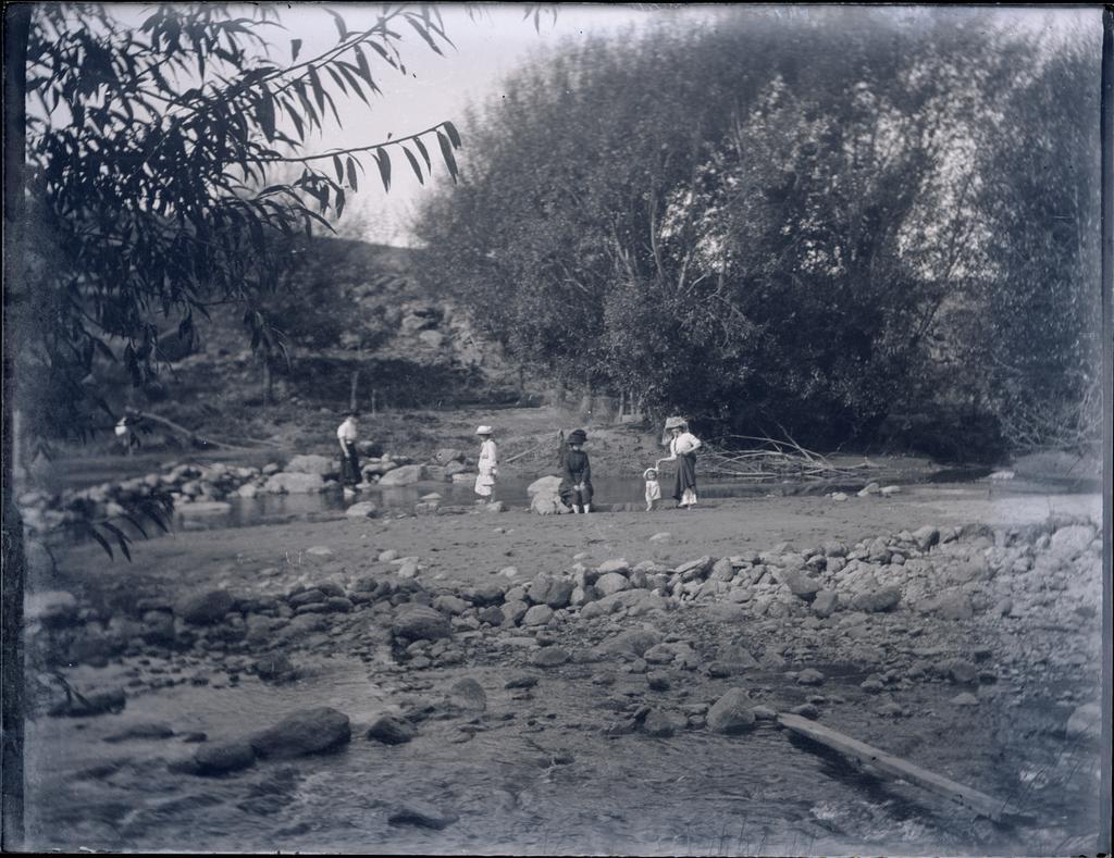 Family paddling in a river