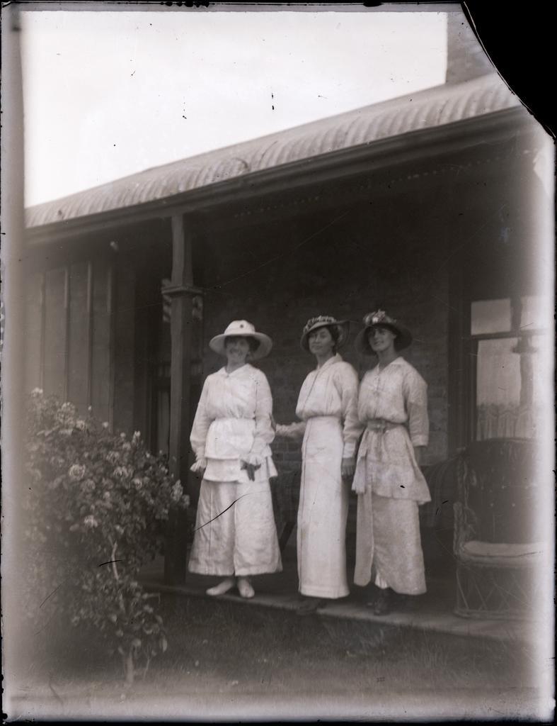 Three women on a porch