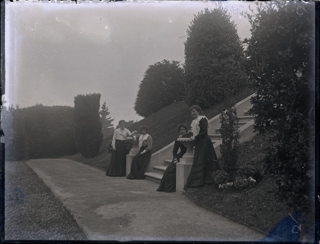 Four women in a formal garden