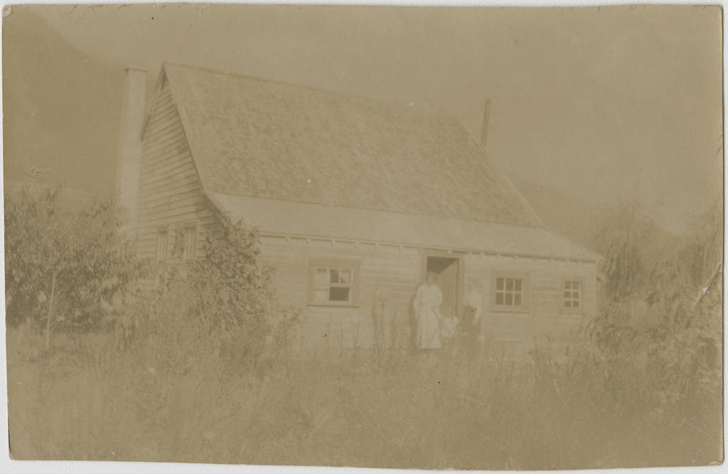 Mrs Rex Dunning outside their home at Makarora, Lake Wanaka