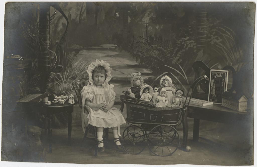 Elsie Annie Price with her dolls and tea party