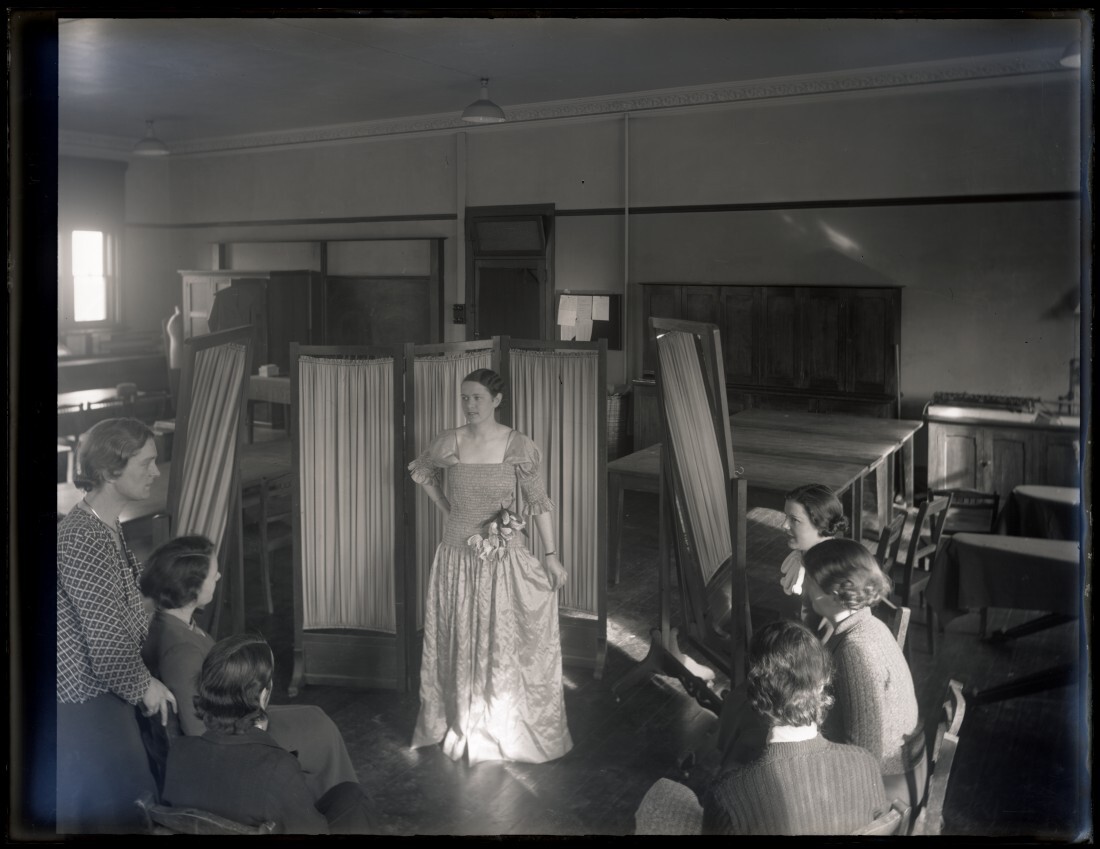 Class with a model wearing a dress, School of Home Science