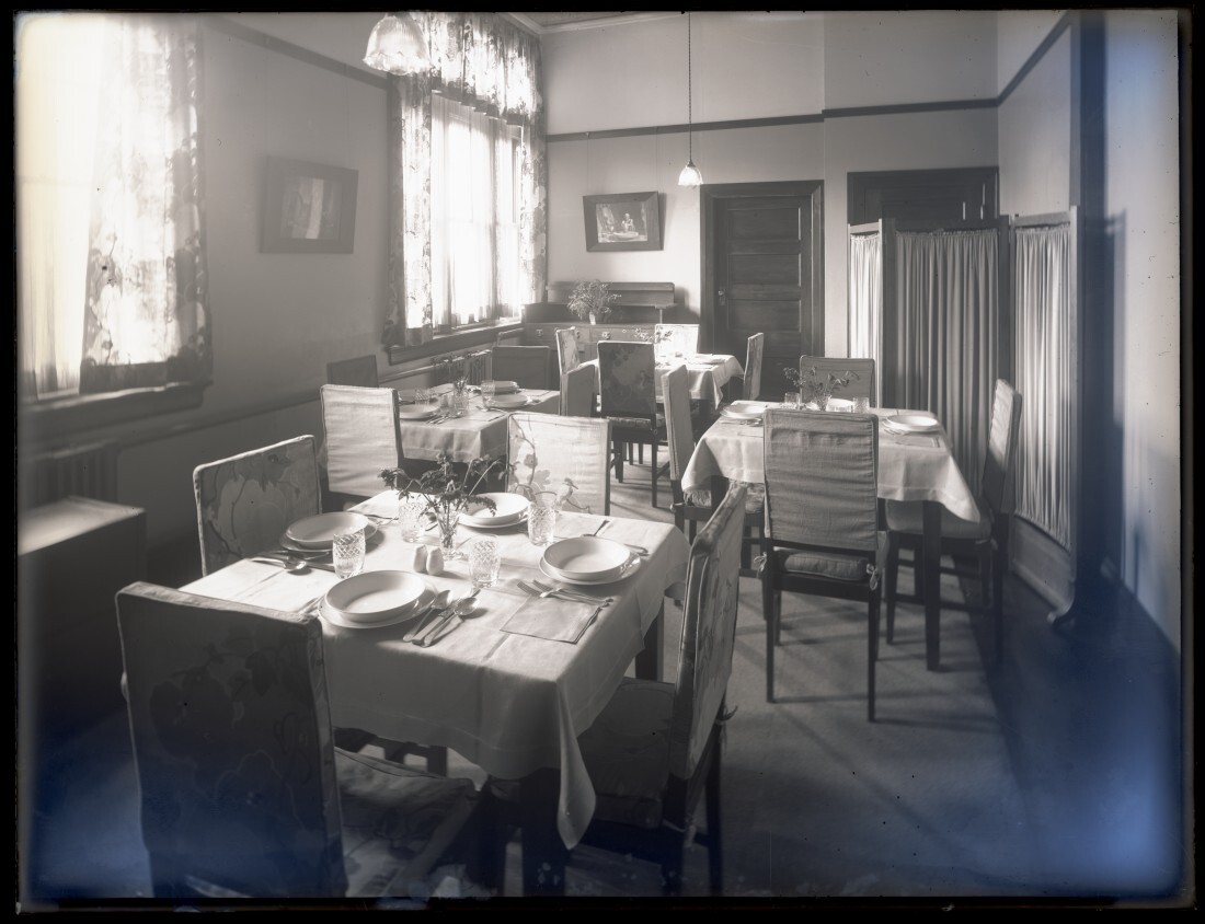 Tables with place settings at Studholme Hall, School of Home Science