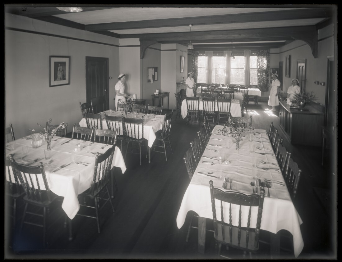 Dining room with place settings, Studholme Hall, School of Home Science