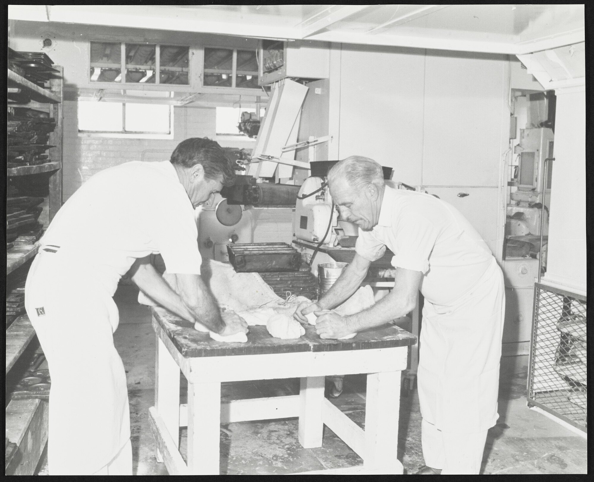 Two men kneading dough at Laurenson's Bakery