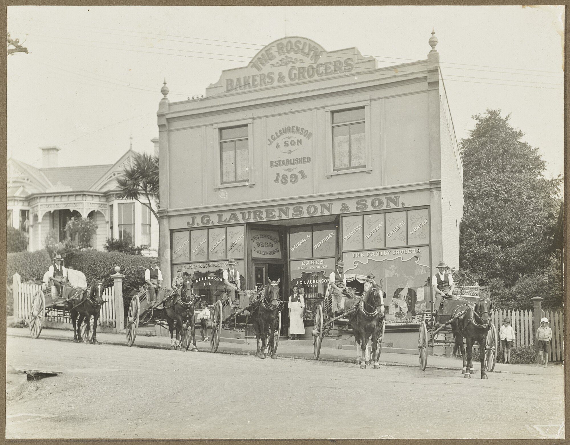 Staff with horses and carts in front of the J.G. Laurenson &amp; Son shop and bakery, Roslyn
