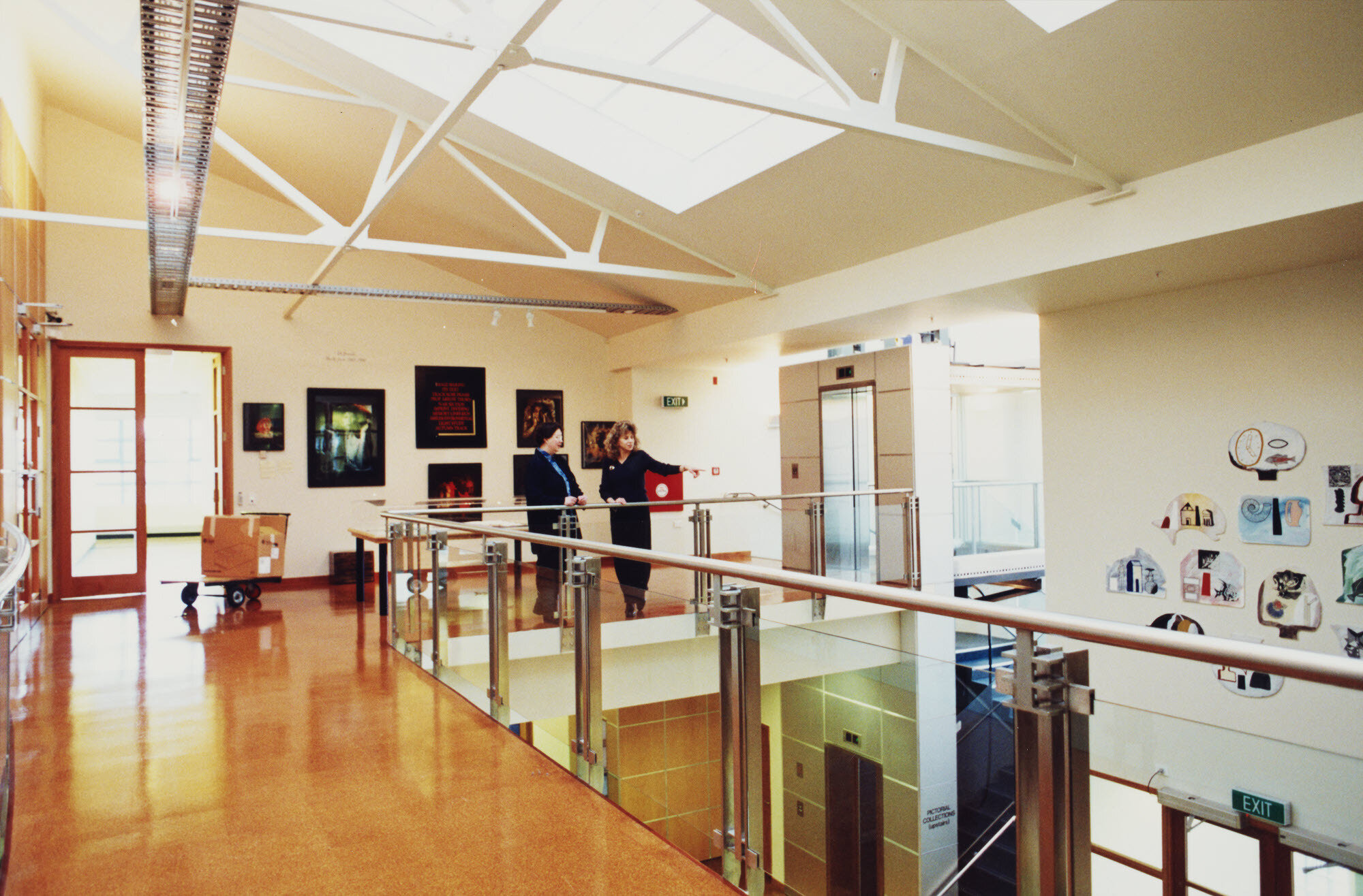 Hocken Library mezzanine, Mary Lewis on right