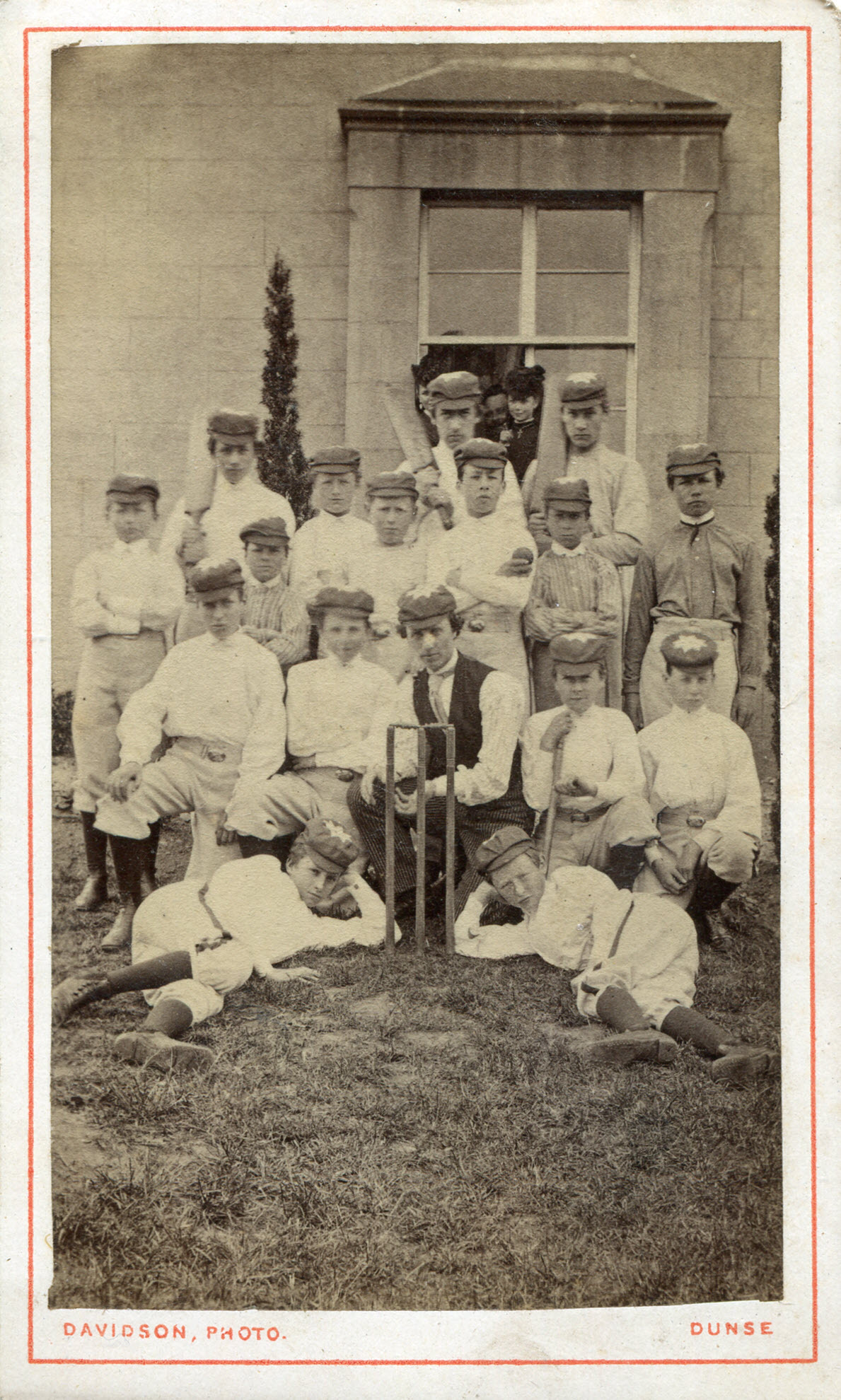 Cricket team at Duns, Scotland, with William Dawson at the back on the right holding a bat