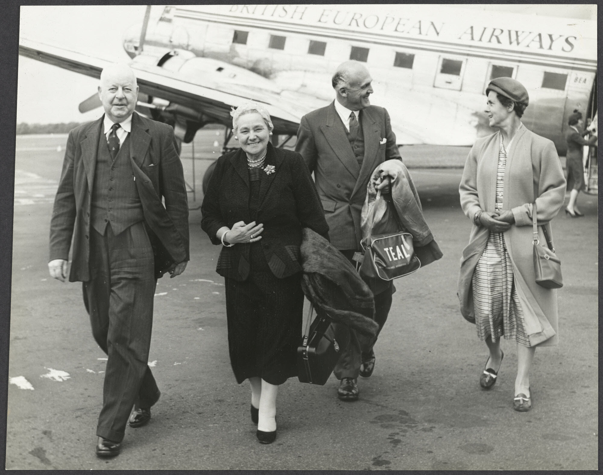Mabel Howard, John McAlpine, and two others on airport tarmac at Belfast, North Ireland