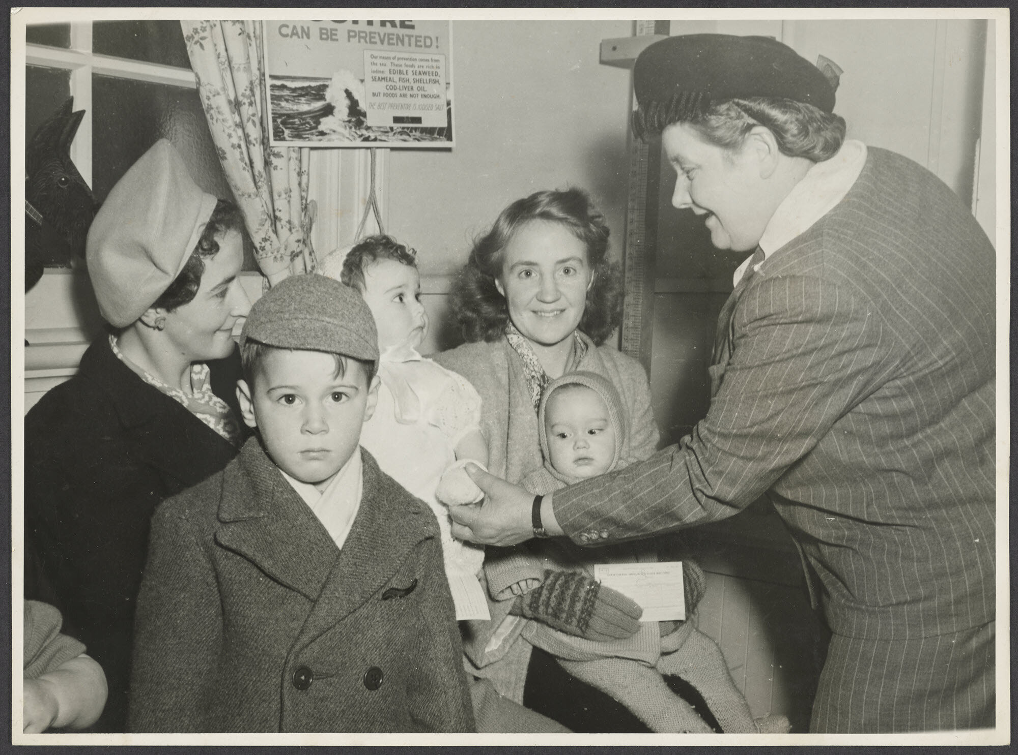 Mabel Howard meeting women and children [at a medical clinic]