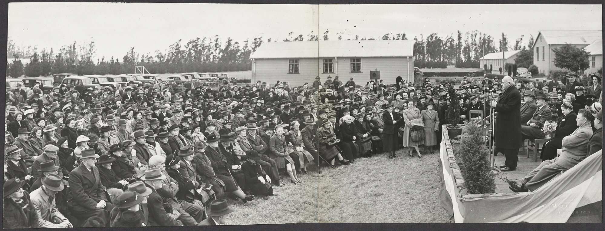 Peter Fraser speaking in front of a crowd at the official opening of Howardville