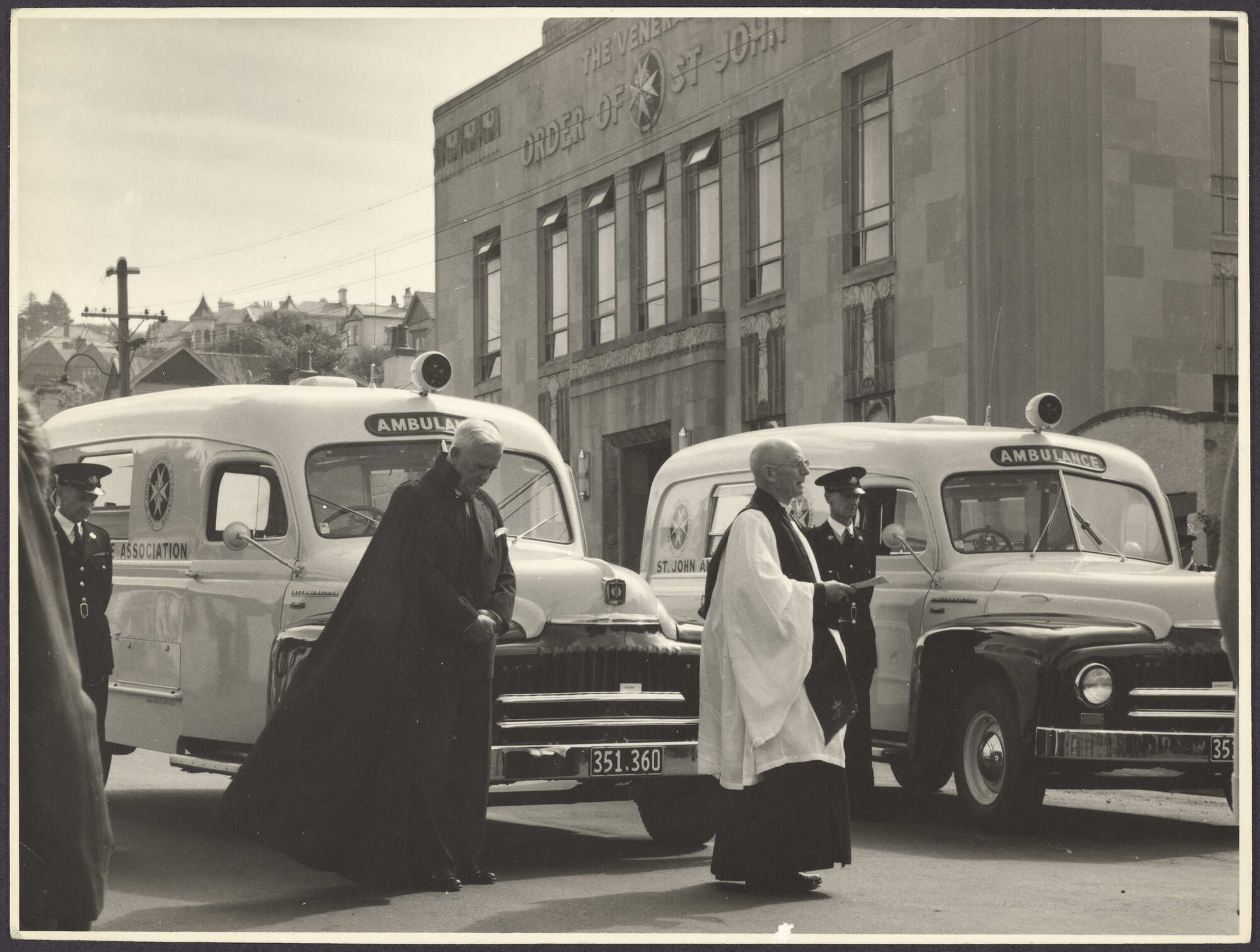 Ceremony on York Place, Dunedin, with two ambulances
