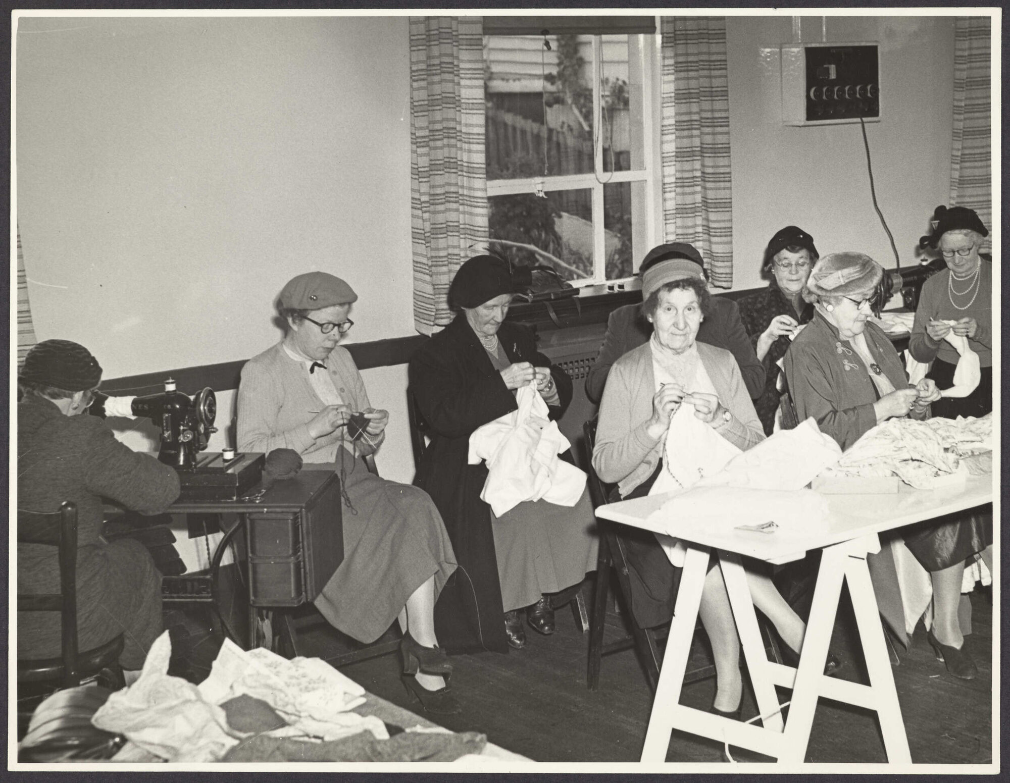 St John Ambulance Association Ladies' Guild members sewing