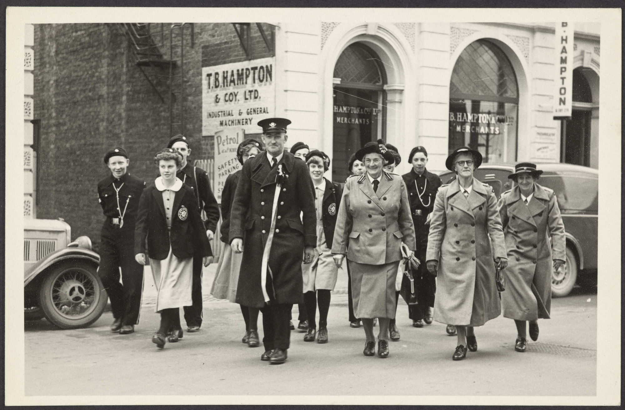 Group of people in Order of St John uniform crossing Moray Place