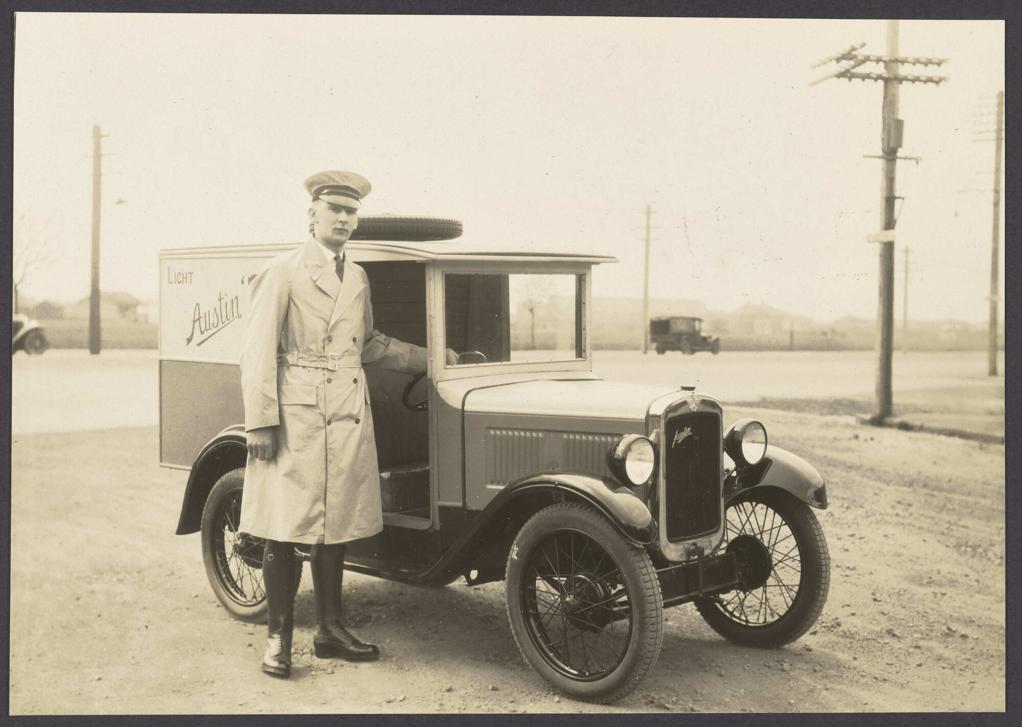 Man in uniform with Austin 7 light van