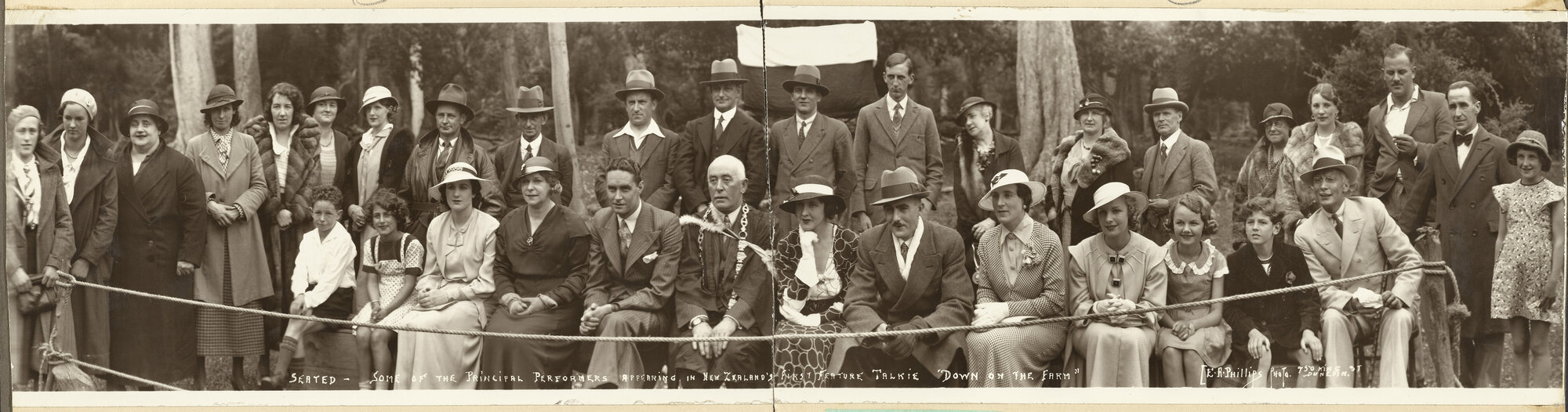 'Seated - Some of the Principal Performers appearing in New Zealand's First Feature Talkie "Down on the Farm"'