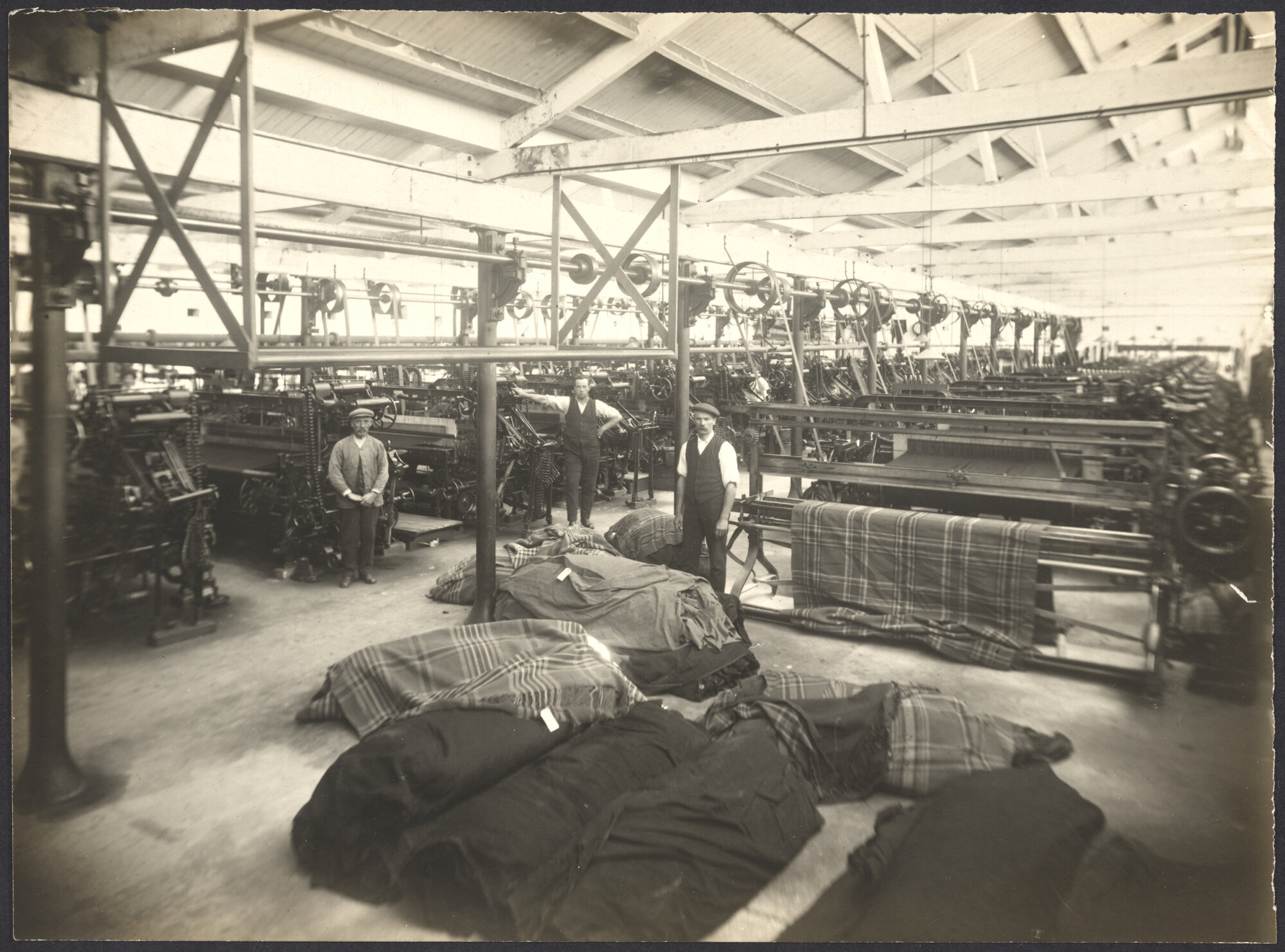 Interior view of large room with power weaving looms