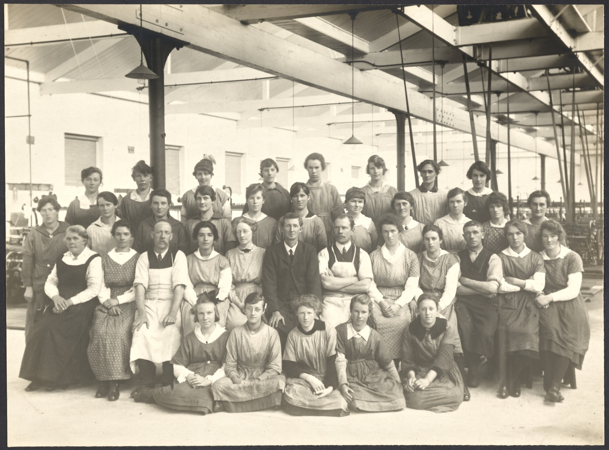 Staff group in front of machinery