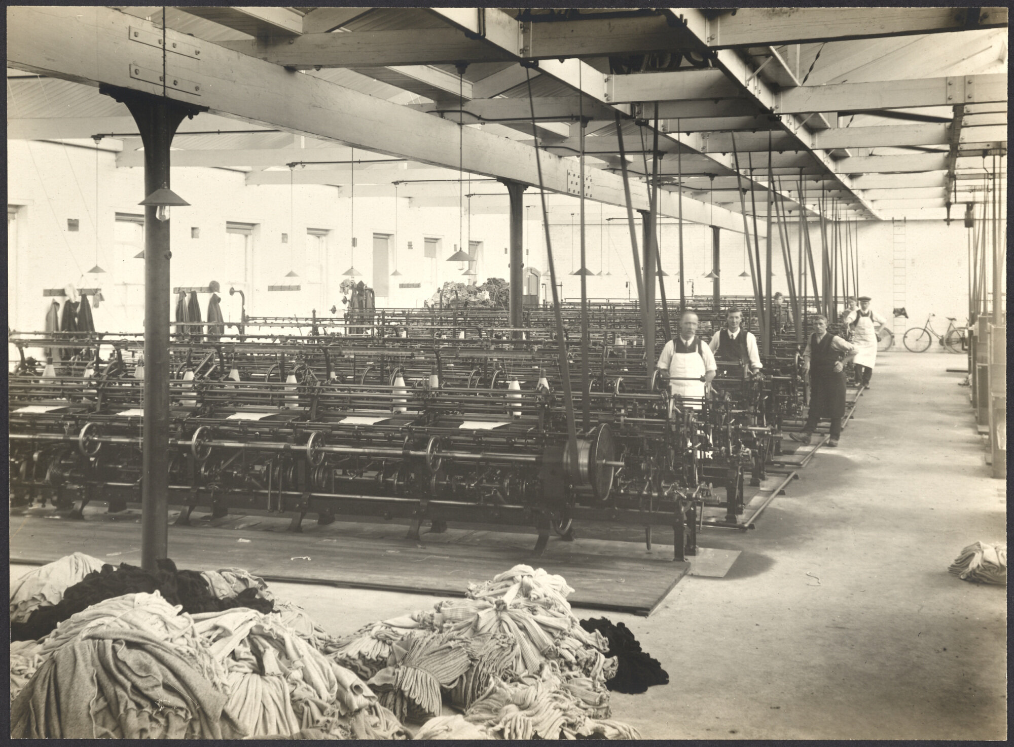Workers with frame knitting machines