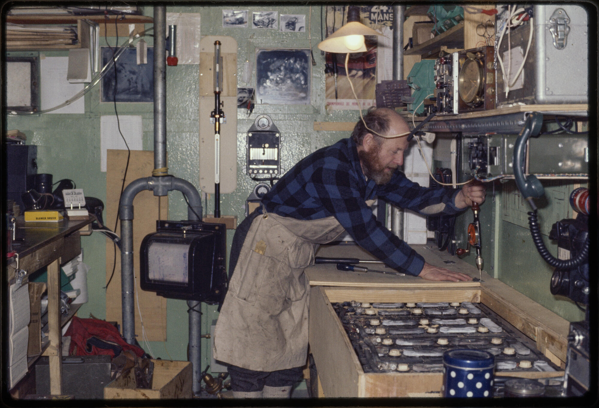 Harold Lowe making alteration in laboratory during winter