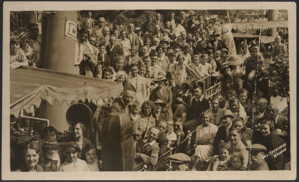 Crowd and pleasure boat [River Thames, England]