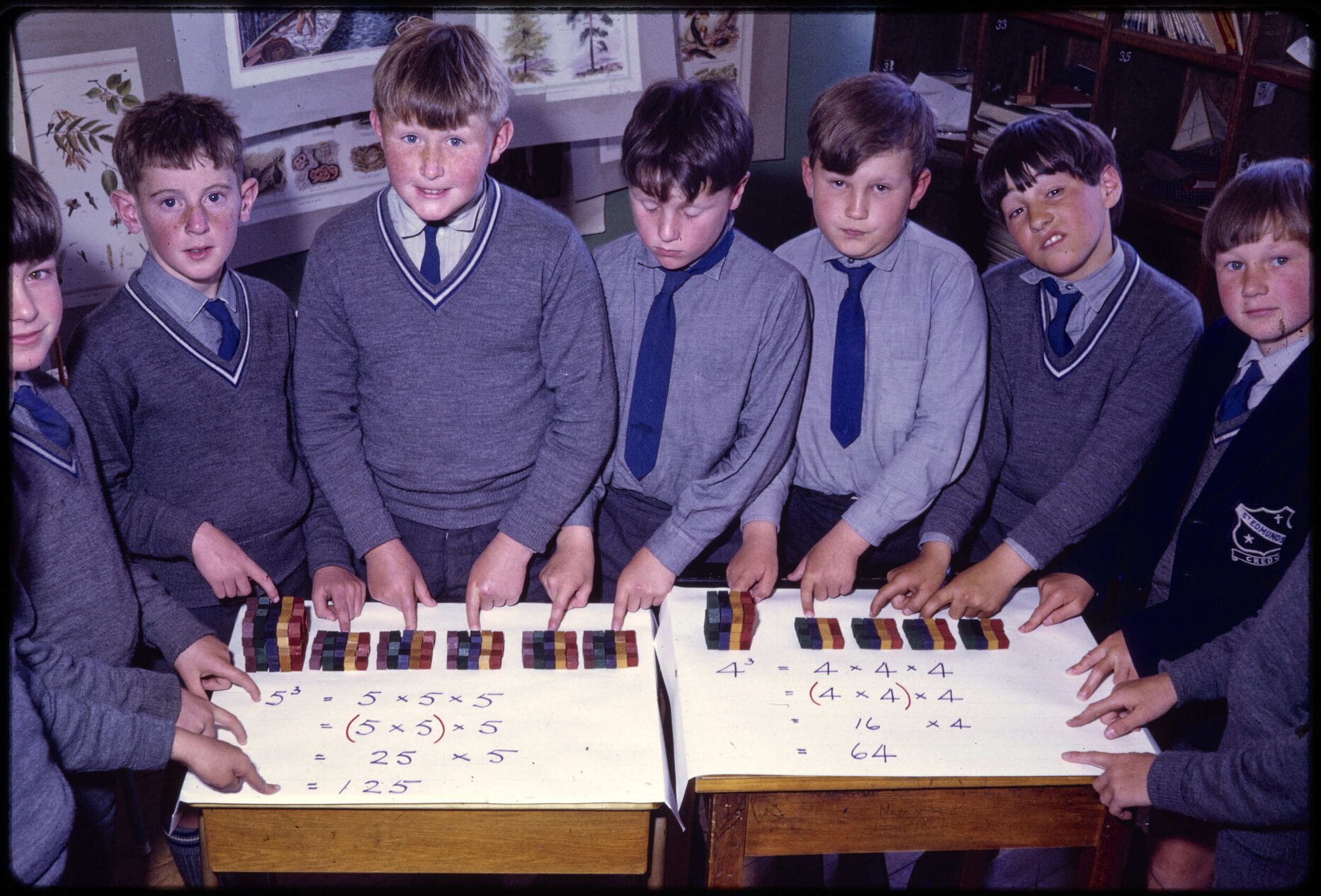 Boys posed with blocks and mathematical equations