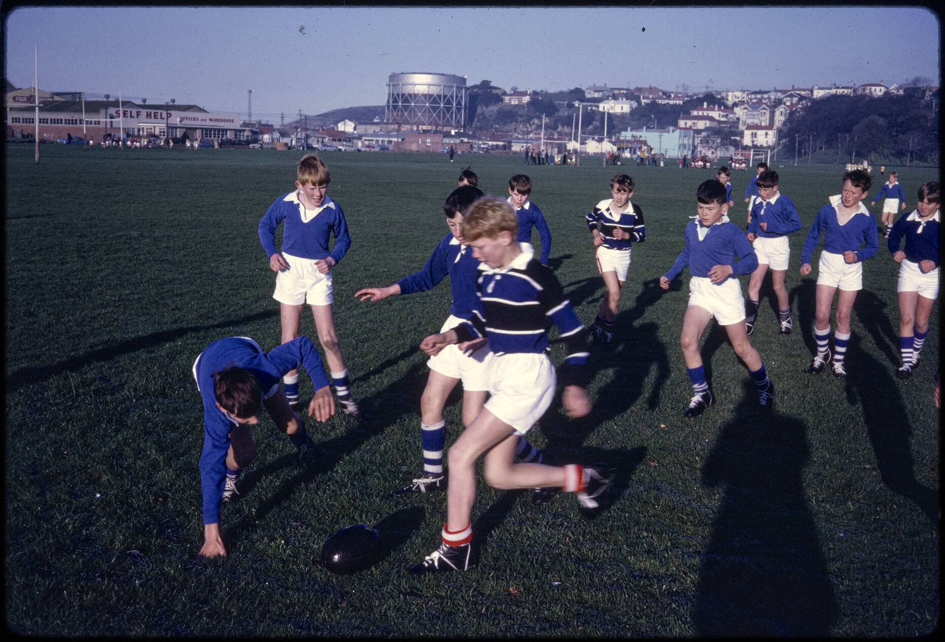 Boys playing rugby at the Oval