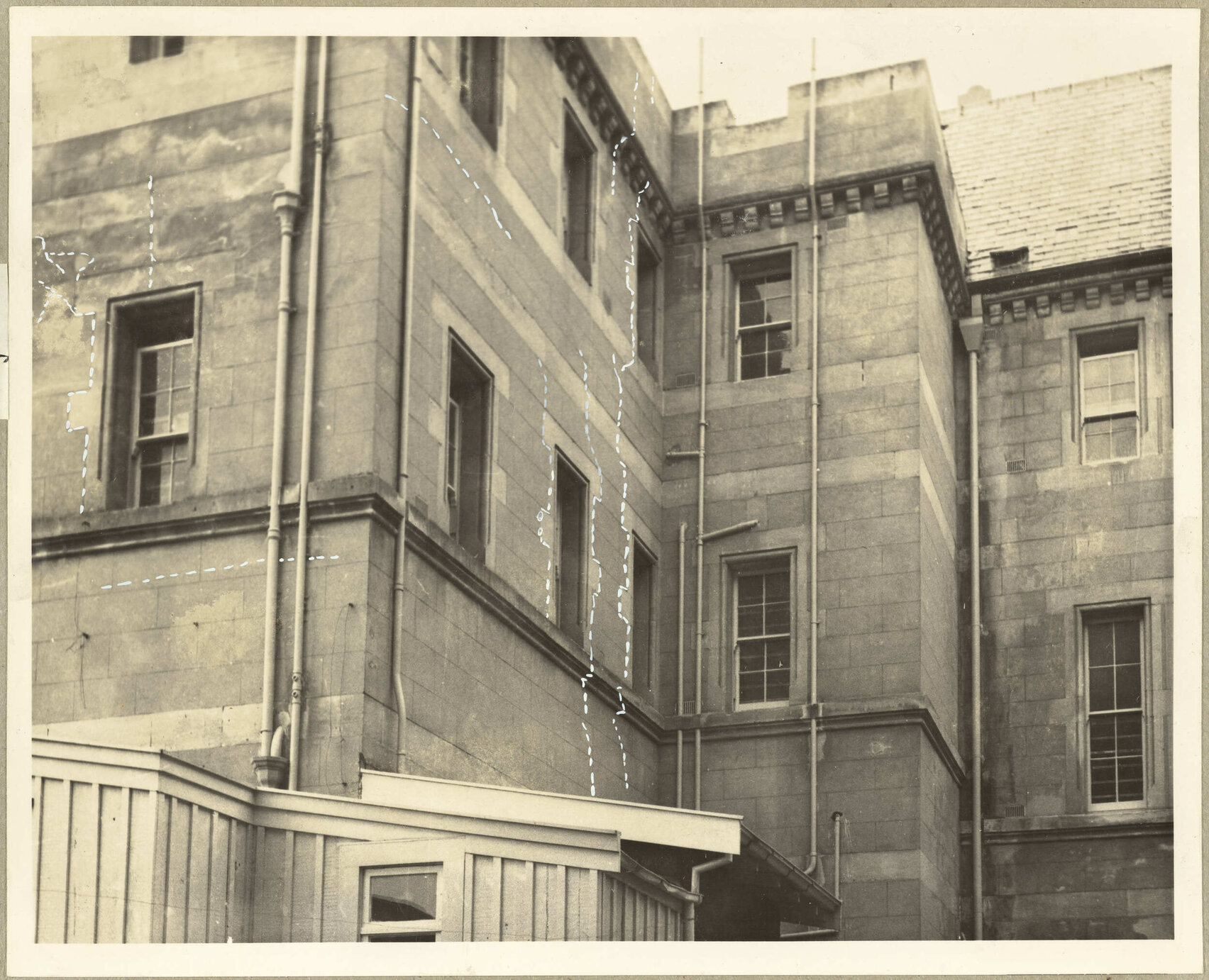 South Wing. Cracks extend from Foundation to Eaves. [Seacliff Hospital]