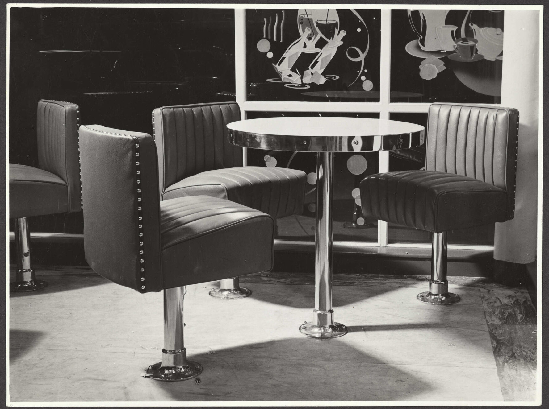 Table and chairs in unidentified bar