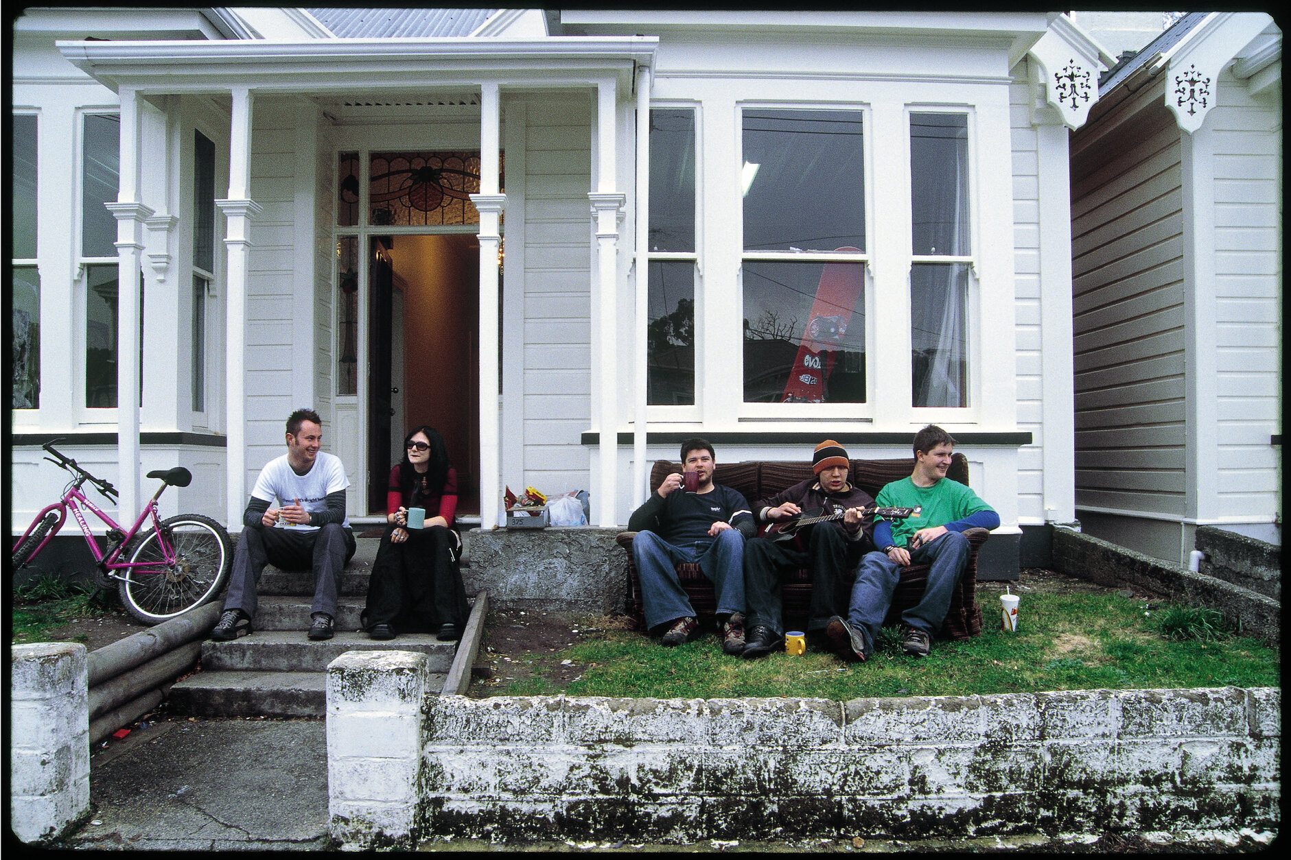 Students sitting outside a flat on Leith Street