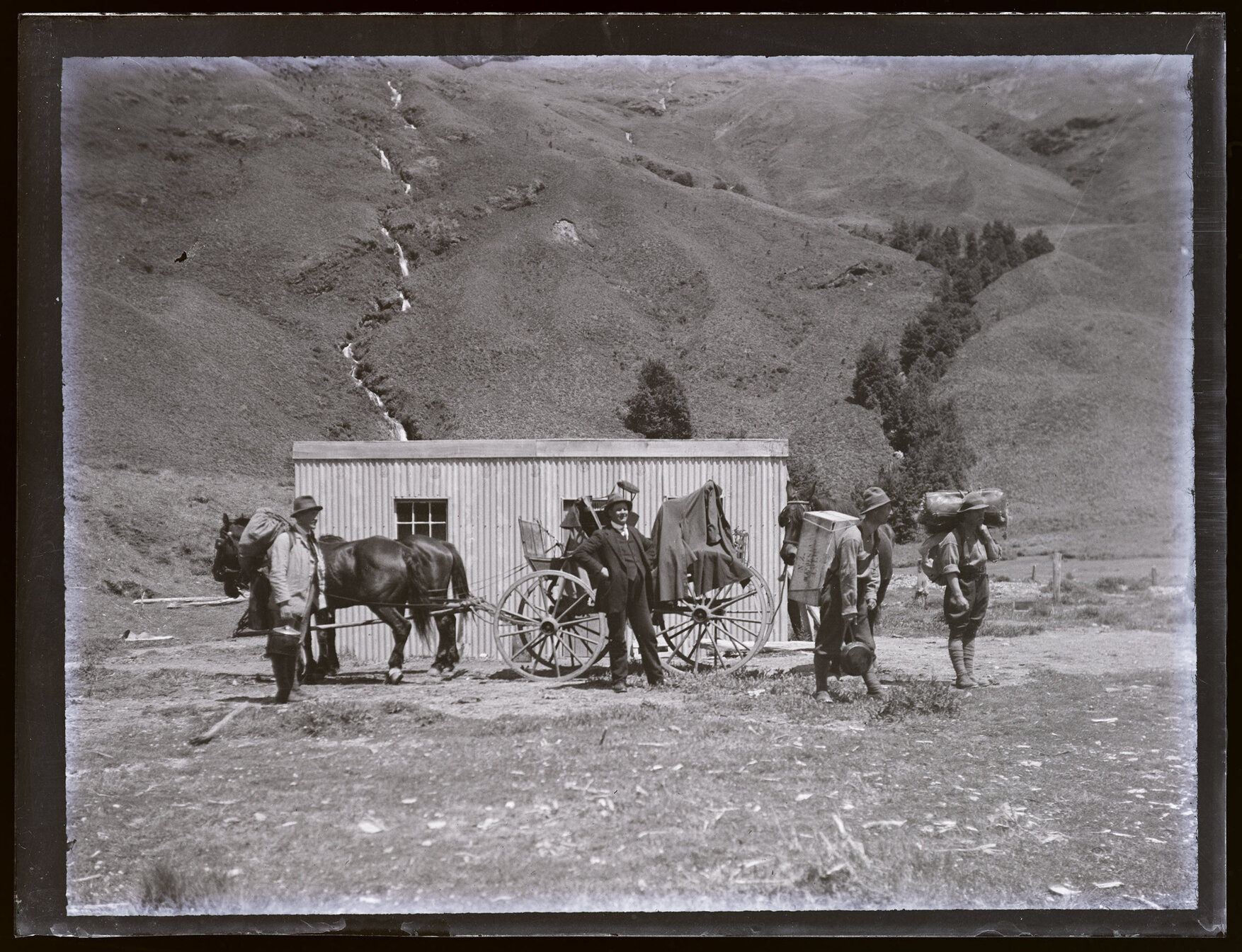 Group in front of hut, Matukituki Valley