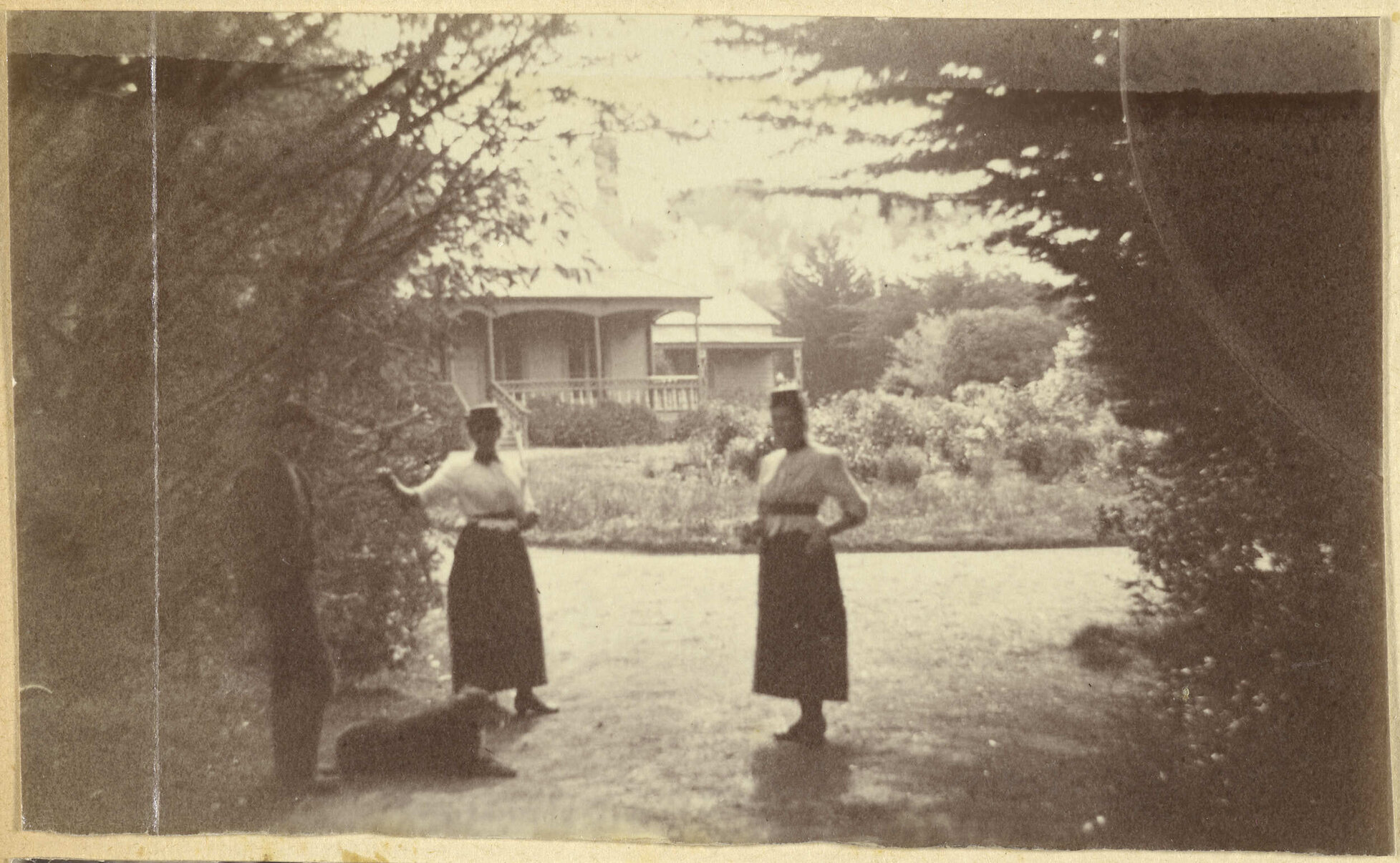 Three figures and a dog