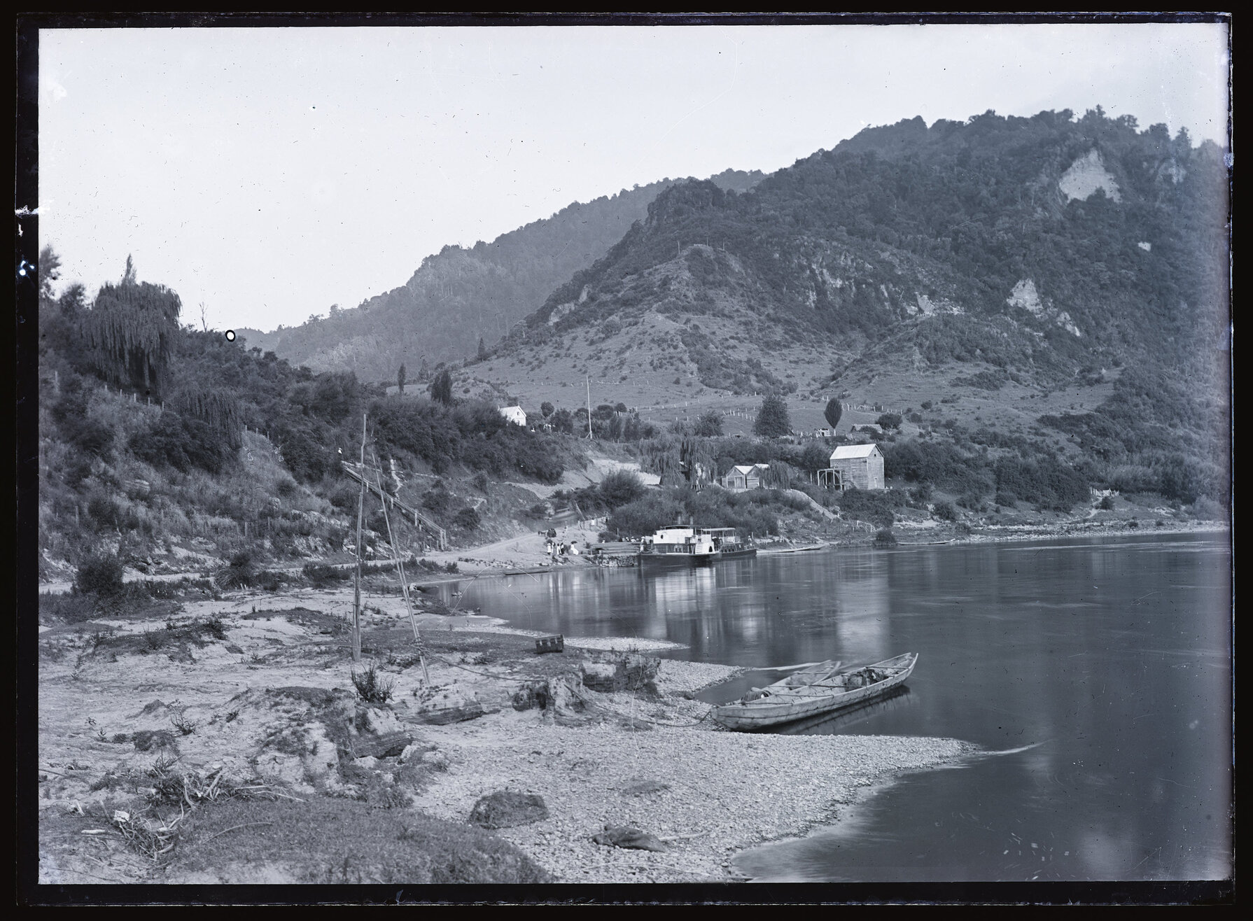 Ferries, boats, and buildings beside unidentified body of water