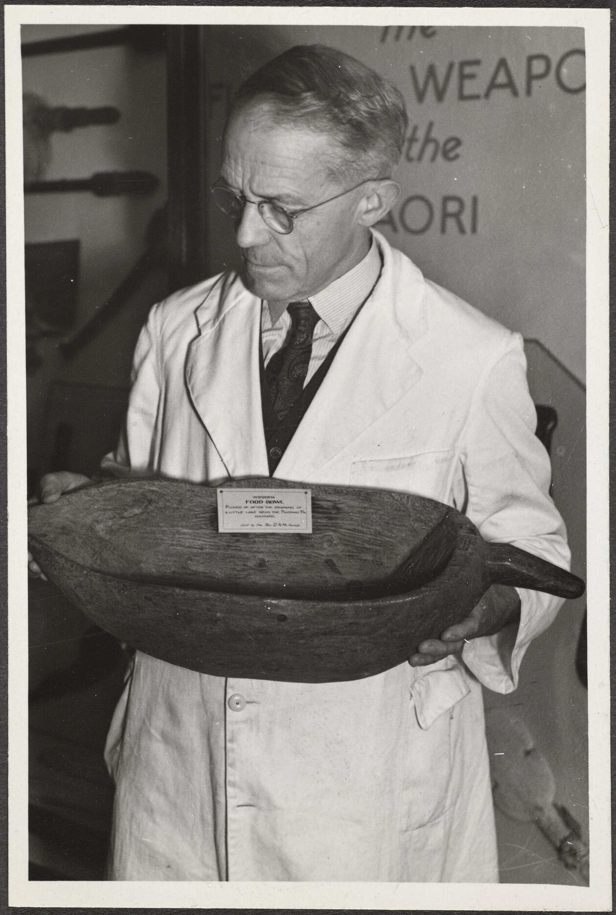 H.D. Skinner holding a kumete roroa (wooden food bowl)