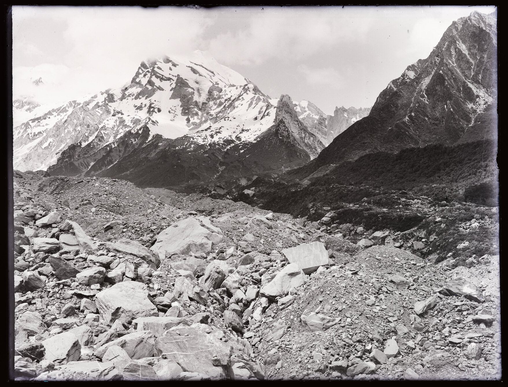 Moraine with snowy peak behind, (east of the Divide?)