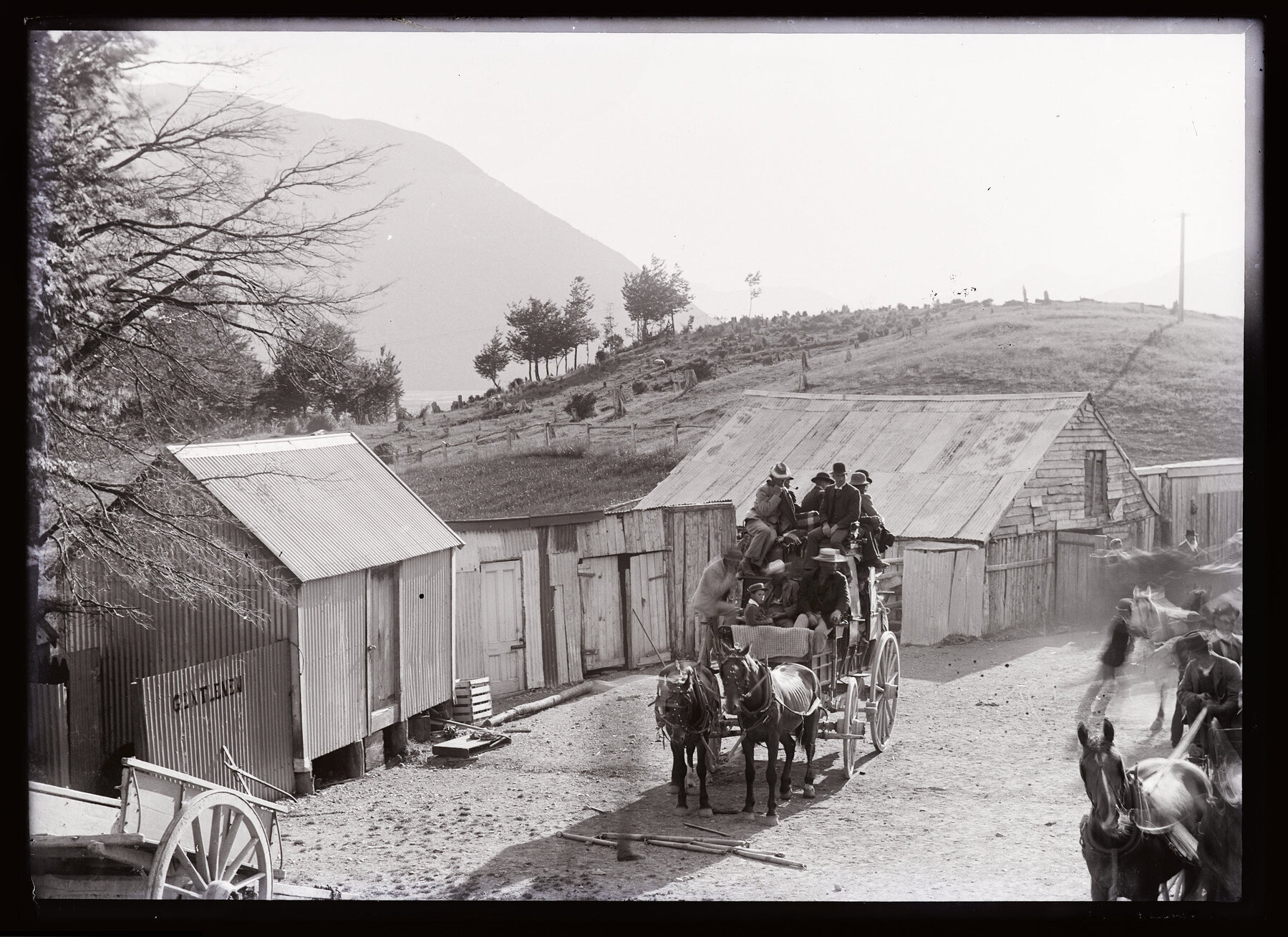 Horse-drawn carriage in small settlement