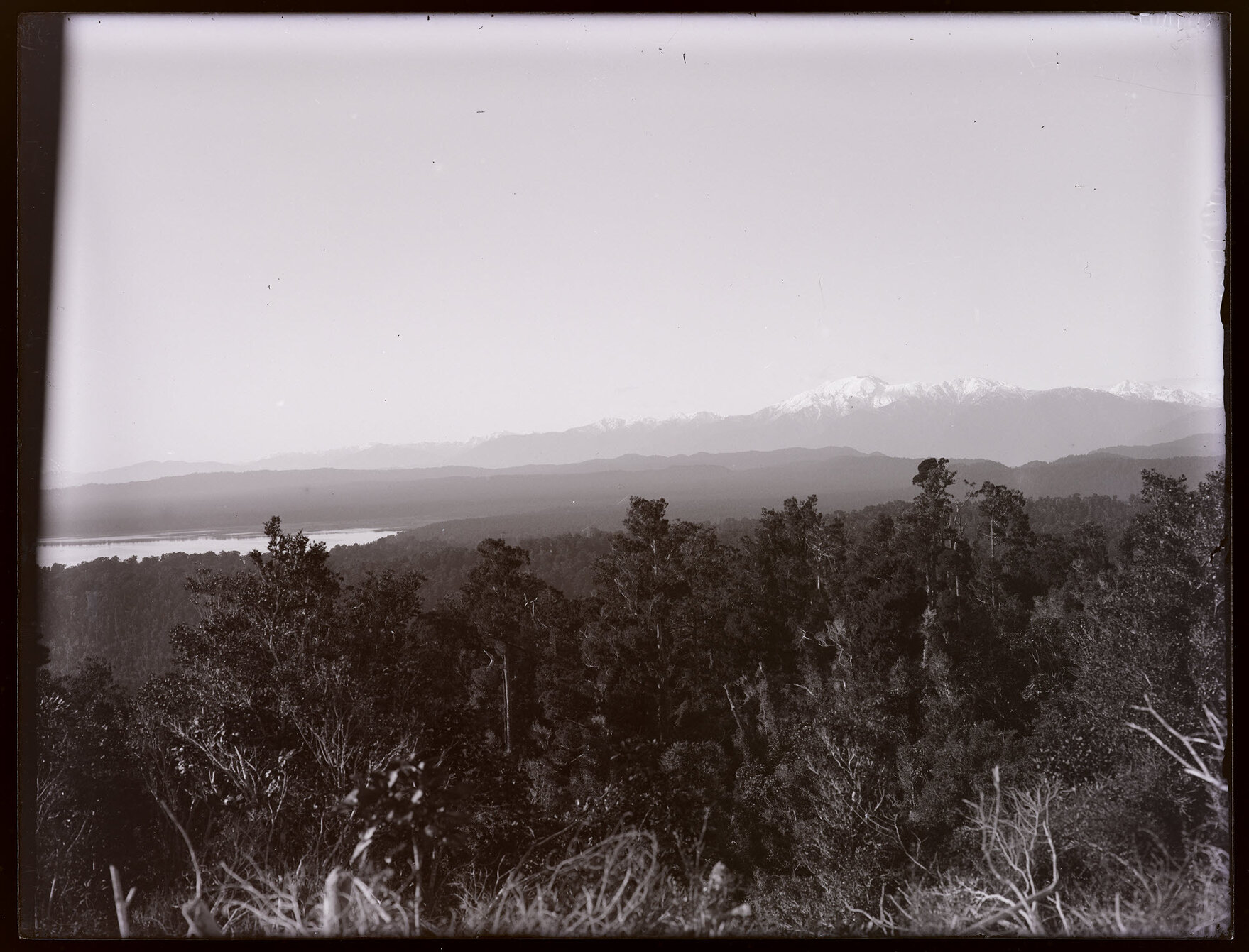 View over forested hills to mountains