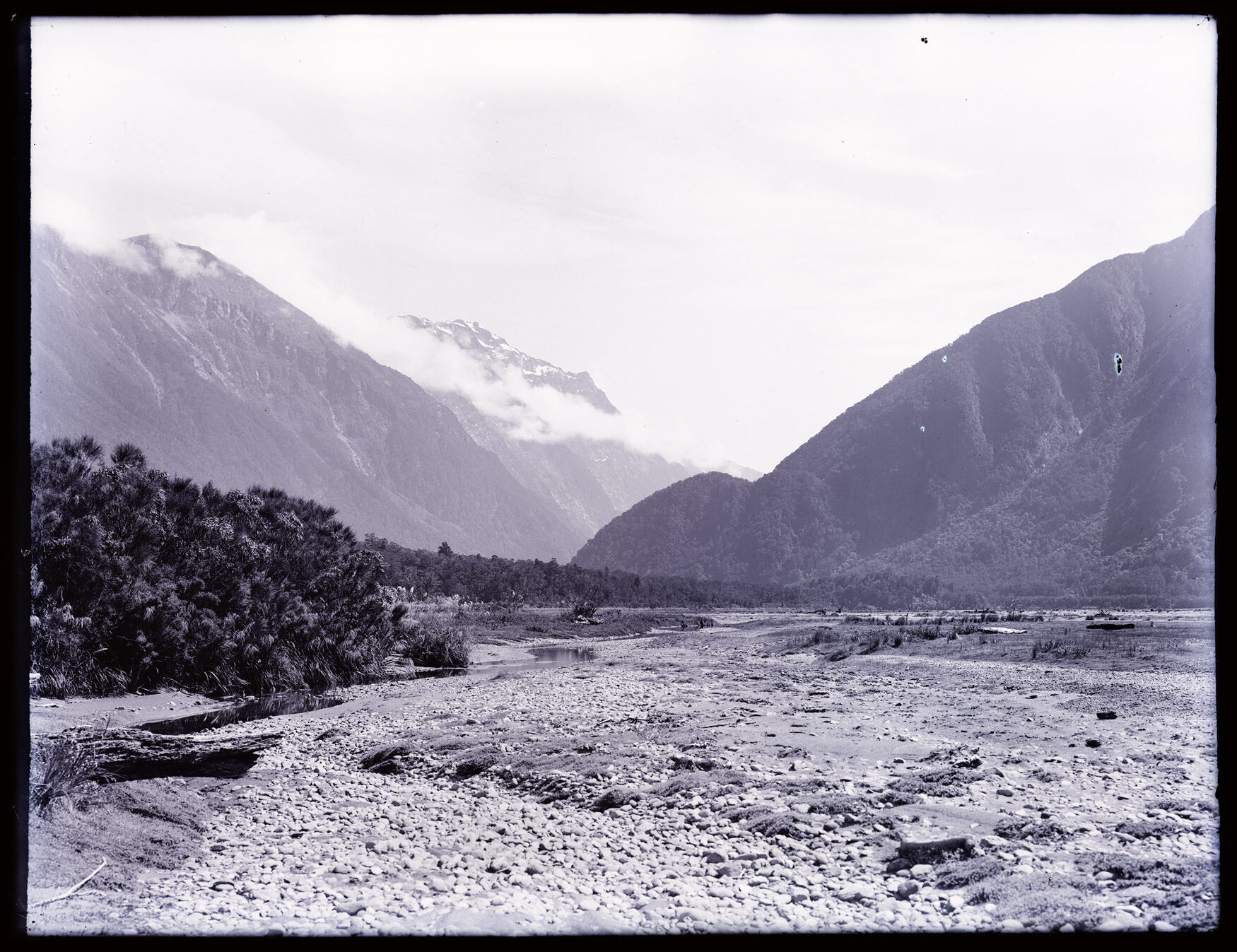 View through valley from riverbank 