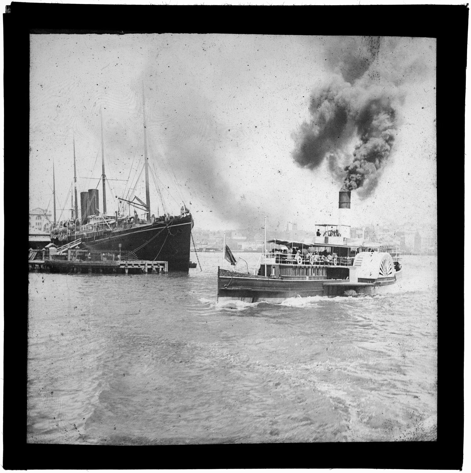 Steamship and paddle steamer in harbour